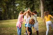 © liderina - Large group of school kids having fun in nature.  Playfully time.