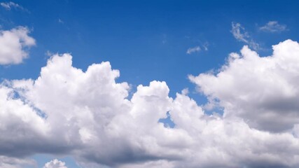 Wall Mural - white clouds motion on blue sky background. time lapse 4k