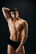 © SHOTPRIME STUDIO - man with a pumped-up muscular body holds his hand on his head close-up