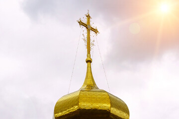 Domes of a religious building. Crosses on the domes of the church. Cathedral with gold domes.