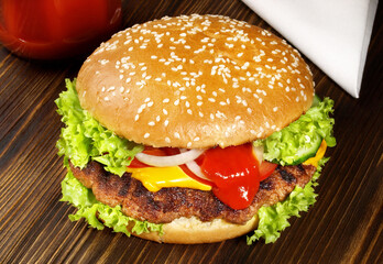 Sticker - Grilled Cheeseburger with Ketchup on wooden Background