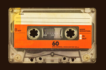 Wall Mural - retro styled image of an old audio compact cassette in front of a dark brown background