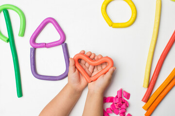 Poster - Baby molding from modeling clay