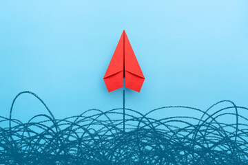 Wall Mural - Business for solution concept. Red paper plane on blue background