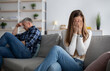 © Prostock-studio - Upset mature woman crying on sofa after fight with her husband at home, copy space