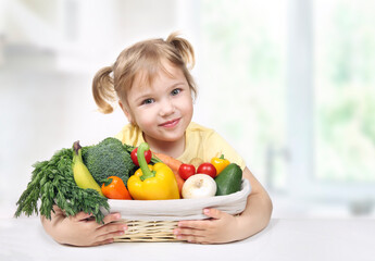 Child holding basket of fresh fruits and vegetables.Kid's healthy nutrition. Eco fresh grown food concept.