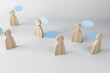 © Who is Danny - Wooden figures with speech clouds on a light background. Social network and communication concept, 3d rendering