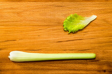 Lettuce And Celery On A Wooden Table