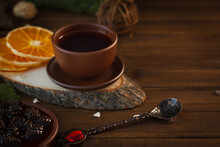Tea In A Clay Ceramic Cup On A Wooden Table In A Dark Moody Style