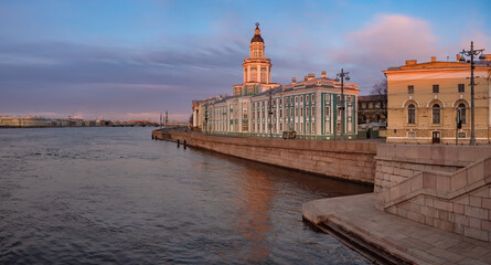 Wall Mural - Saint-Petersburg in the white nights. Vasilievsky Island in the early morning. Cities of Russia. Dawn in St. Petersburg. Kunstkamera on the background of a beautiful sky. Petersburg rivers. Neva river