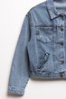Blue denim jacket for background. Close up of the front of a denim jacket. Close-up denim jacket pocket. Denim texture background.