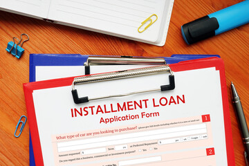 Financial concept meaning INSTALLMENT LOAN Application Form with sign on financial document.