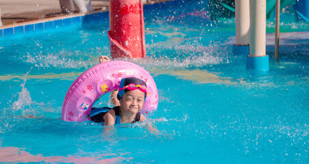 Wall Mural - Children frolic at the water park. It is a sunny, perfect day for getting wet and playing hard