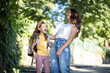© liderina - Little school girl with her mother in nature.