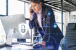 Businessman in suit has conference call of cyber security in compliance division to protect clients confidential information. IT hologram lock icons over office background with panoramic windows.