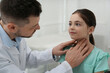 © New Africa - Pediatrician examining little girl in office at hospital