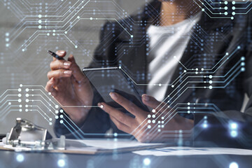 Businesswoman is signing the contract to create fin-tech start up for the conference and gain investments for innovative service. Checking the details at smartphone. Hologram tech graphs.