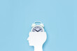 Human head with alarm clock. Concept of time management. Copy space. Selective focus