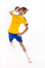 Full Length Photo Of A Young Sporty Boy Throwing Handball To The Camera,