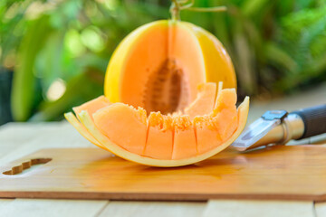 Closeup to piece of fresh orange melon on the plate