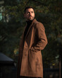 © RafaelAnRios - Fall portrait of a bearded man with a brown coat at sunset time in the park