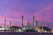 © APchanel - Oil refinery industry power station plant under working production petrochemical energy at dark night sky background.