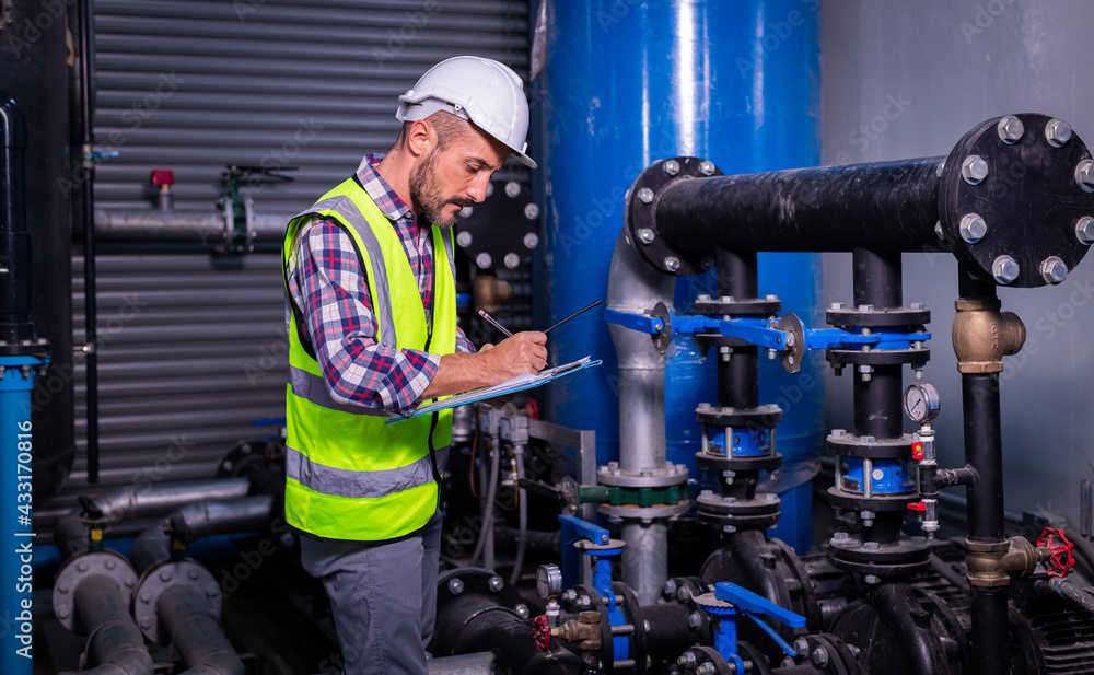 Industry engineer under checking industry cooling tower air conditioner ...