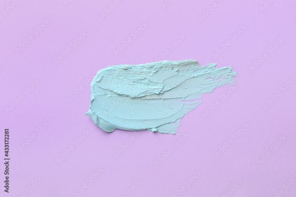 Sample of cosmetic clay on color background