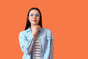 Sticker - Beautiful young woman wearing eyeglasses on color background