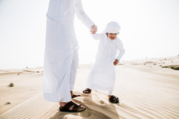 Wall Mural - father and son spending time in the desert