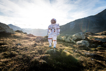 Wall Mural - astronaut exploring a new planet. searching for a new home for humanity. concept about science and n