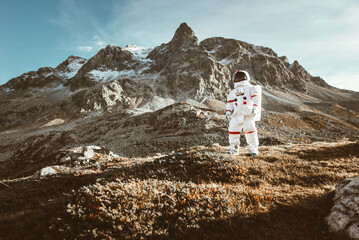 Wall Mural - astronaut exploring a new planet. searching for a new home for humanity. concept about science and n