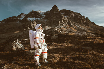 Wall Mural - astronaut exploring a new planet. searching for a new home for humanity. concept about science and n