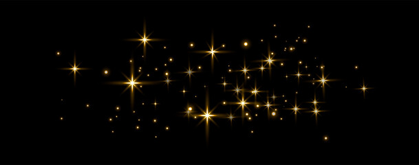 gold glittering dots, sparkles, particles and stars on a black background. abstract light effect. go