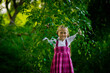 happy girl in purple dress, outdoor walks happy childhood selective focus
