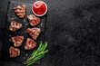 © александр таланцев - several mini Grilled beef T-bone steaks on stone background with copy space for your text
