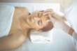 © rogerphoto - Beautician doing beauty procedure with syringe to face of young brunette woman in sunny clinic. Cosmetic medicine and surgery, beauty injections