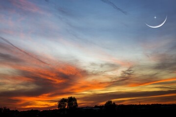 Wall Mural - crescent moon with beautiful sunset background . bright sky
