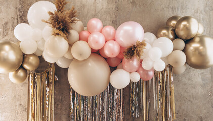 balloons with helium in pastel colors pink, white and beige as a decoration for a birthday or anniversary and a background for photos and greetings