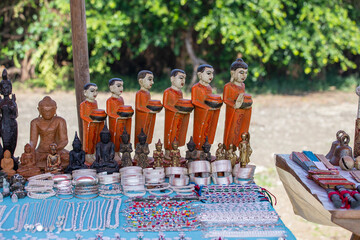 Wall Mural - Handmade monk figurine and other souvenir in a tourist stall on the street market near Inle Lake in Burma, Myanmar