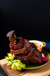Food concept German pork hock or pork knuckle with sauerkraut cabbage pickle on wooden board with copy space