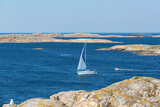 Fototapeta  - Sailboat in the rocky sea archipelago on the Swedish west coast