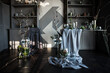 modern beautiful dark interior, room gray color, wardrobe shelves unusual gloomy decor table fabric cloth, dried flowers, vases with water, moss, branches, unusual style, halloween