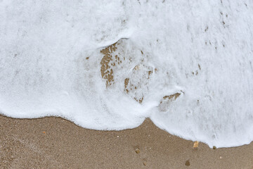 Wall Mural - Wave of the sea water at sunny day time.