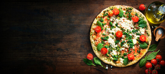 Wall Mural - Crispy spinach pizza with ricotta, mozzarella and tomatoes