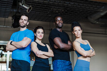 Multi-ethnic Group Of Sports People With Arms Crossed Standing In Gym