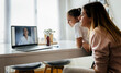 © Marco Govel/Westend61 - Girl and woman listening to female pediatrician on video call through laptop at home