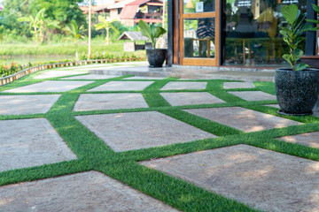 decoration floor by artificial grass and concrete.