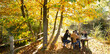 © Martin Barraud/Caia Image - Business people meeting at table in sunny idyllic autumn park