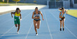© Trevor Adeline/Caia Image - Female track and field athletes competing on sunny track